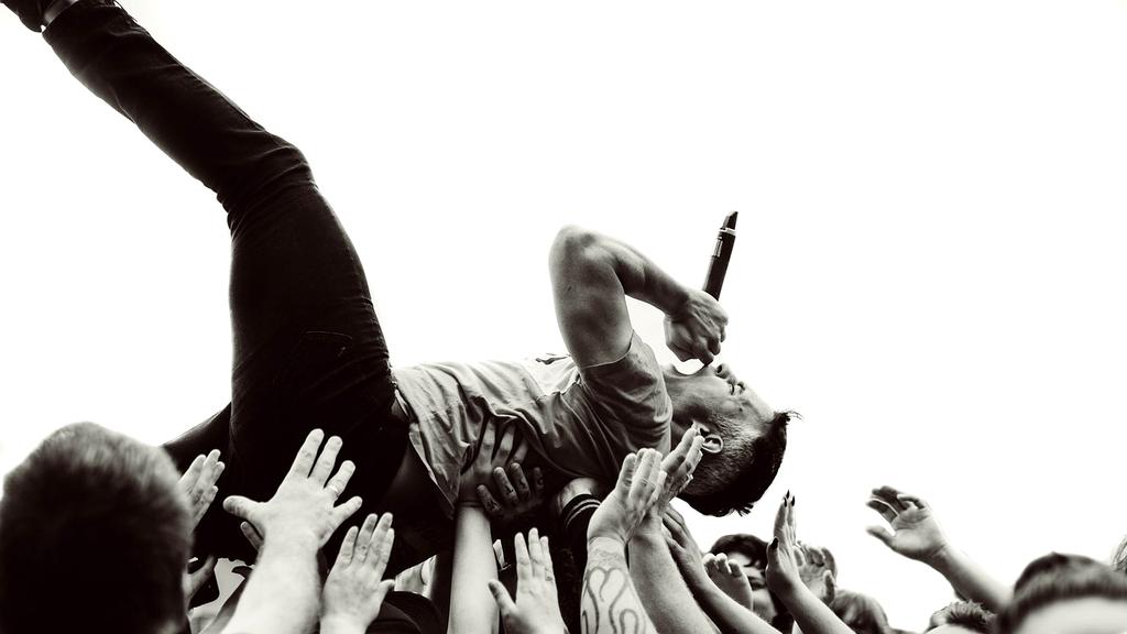 Colorful open-air festival crowd with stage